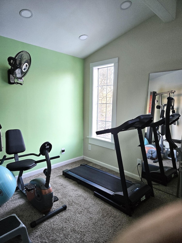 workout room featuring vaulted ceiling