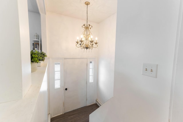 foyer featuring a notable chandelier, a baseboard radiator, and dark hardwood / wood-style floors