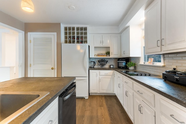 kitchen featuring sink, white cabinetry, dark hardwood / wood-style flooring, decorative backsplash, and black appliances