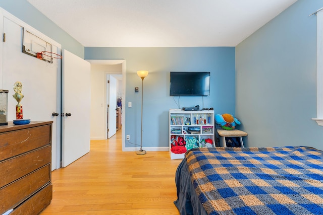 bedroom with light wood-type flooring