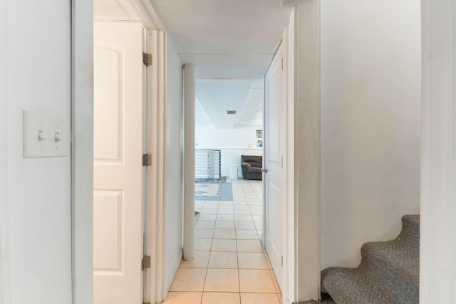 hall with light tile patterned floors