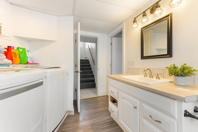 bathroom featuring wood-type flooring, separate washer and dryer, and vanity