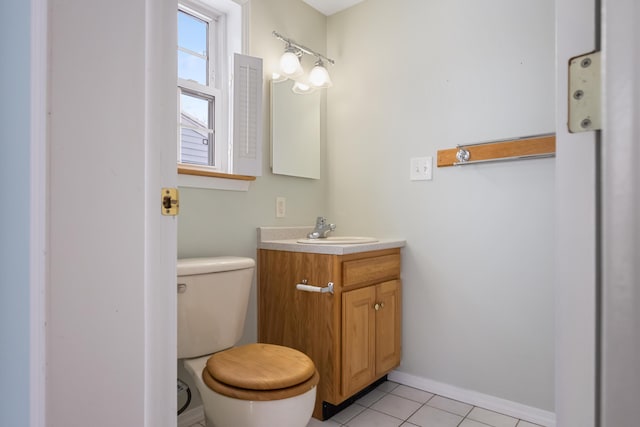 bathroom with vanity, tile patterned flooring, and toilet