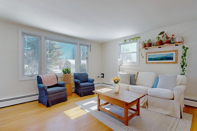 living room with a baseboard radiator and wood finished floors