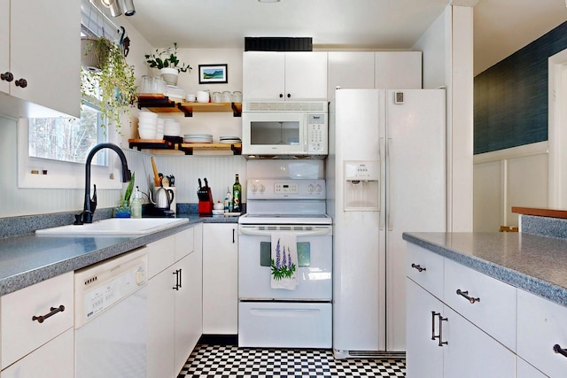 kitchen featuring white appliances, white cabinets, tile patterned floors, open shelves, and a sink