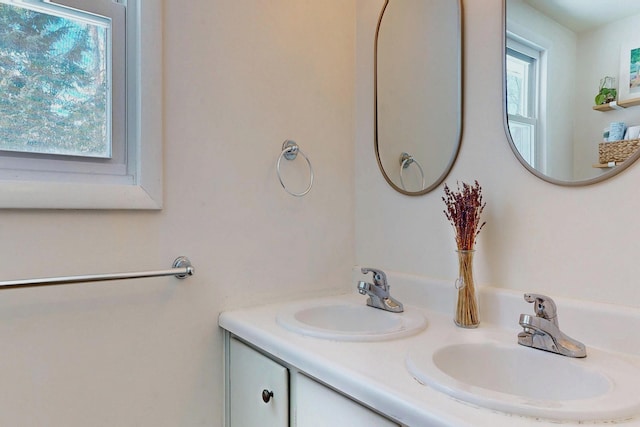 bathroom featuring double vanity and a sink