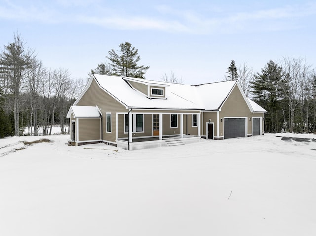 view of front facade with a garage and a porch