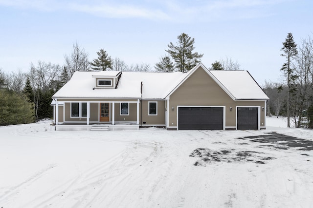 view of front of property featuring a garage and a porch