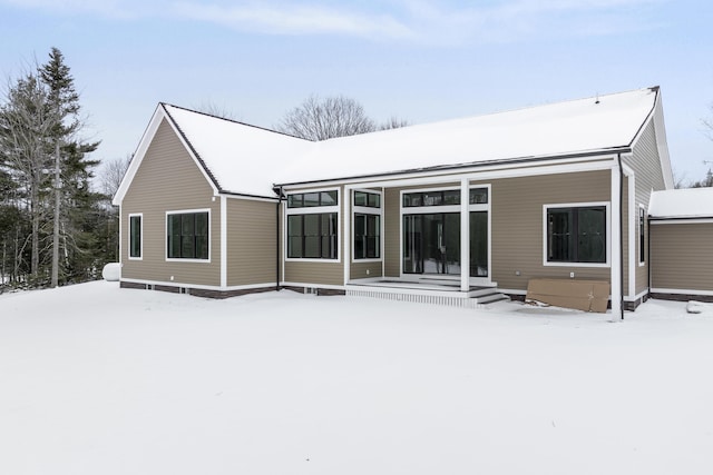 view of snow covered house