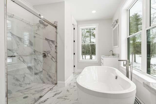 bathroom with sink, separate shower and tub, and baseboard heating