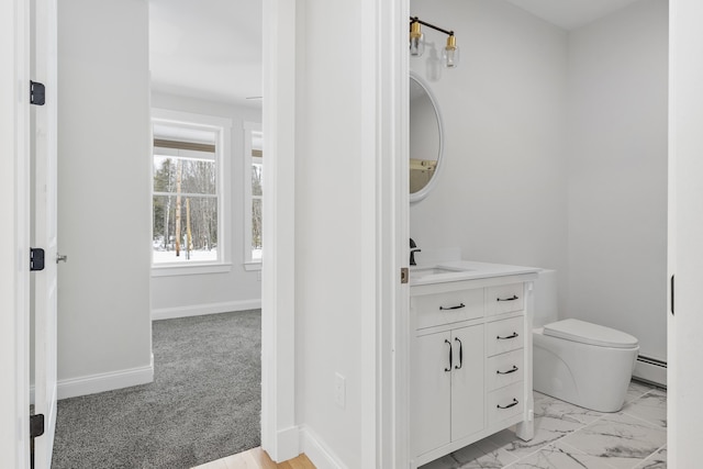 bathroom featuring vanity, a baseboard radiator, and toilet