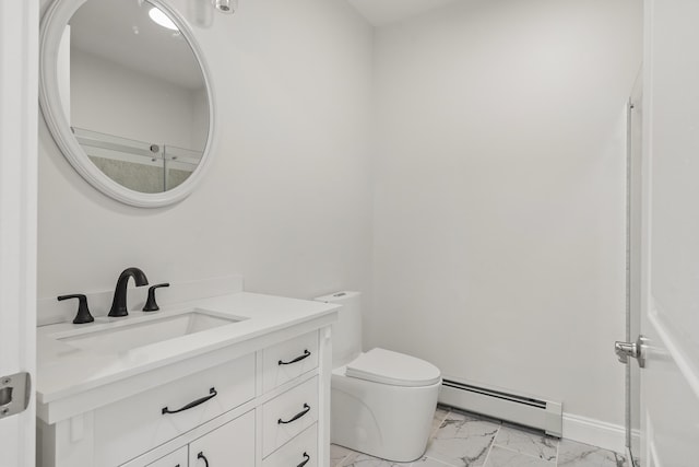 bathroom with vanity, a baseboard radiator, and toilet