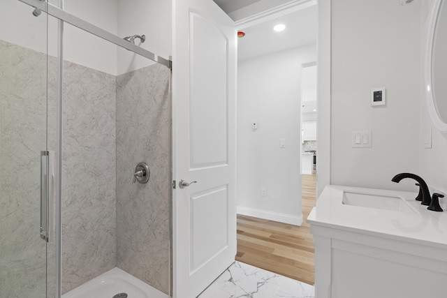 bathroom with vanity, hardwood / wood-style floors, and an enclosed shower