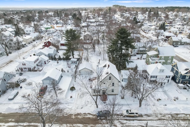 snowy aerial view featuring a residential view