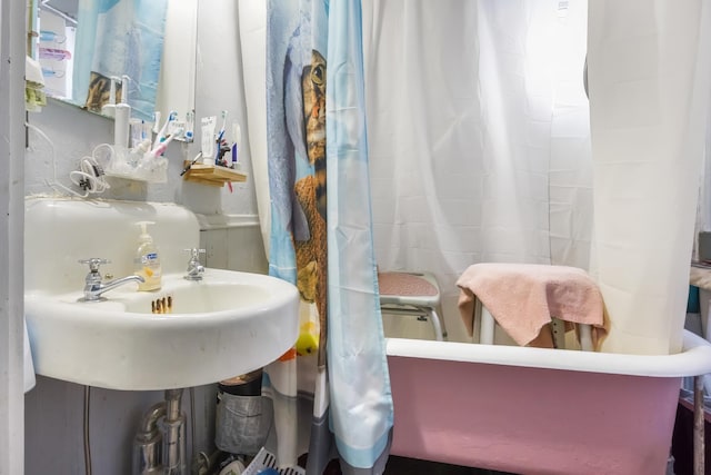 full bathroom with a sink