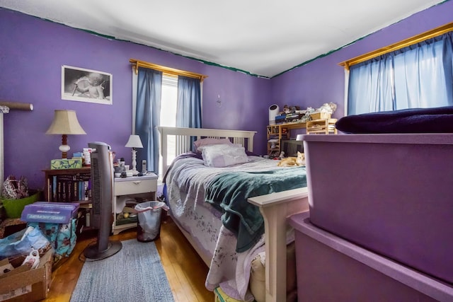 bedroom with wood finished floors