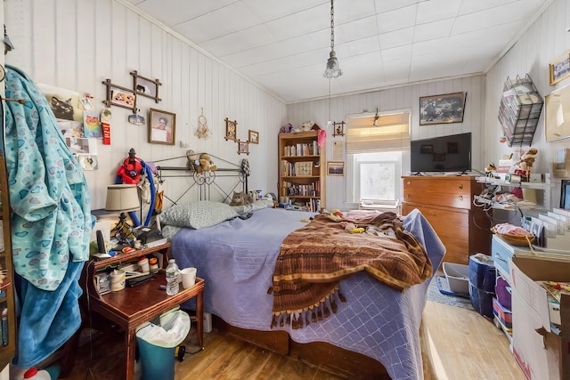 bedroom with wood finished floors