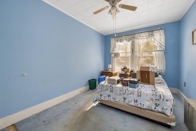 bedroom with crown molding, ceiling fan, and baseboards