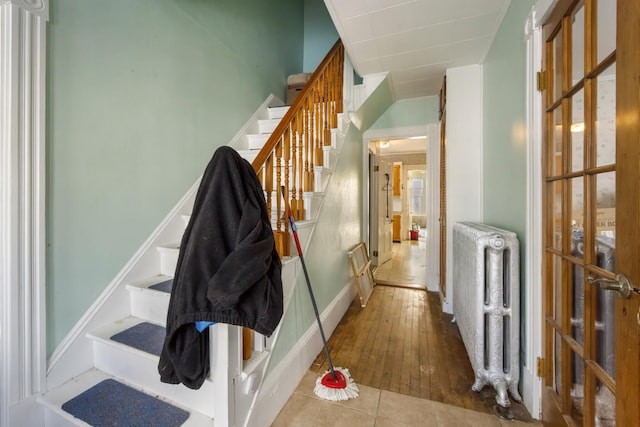 interior space with radiator and tile patterned floors