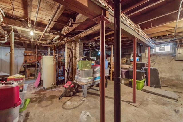 basement with water heater and a wall unit AC