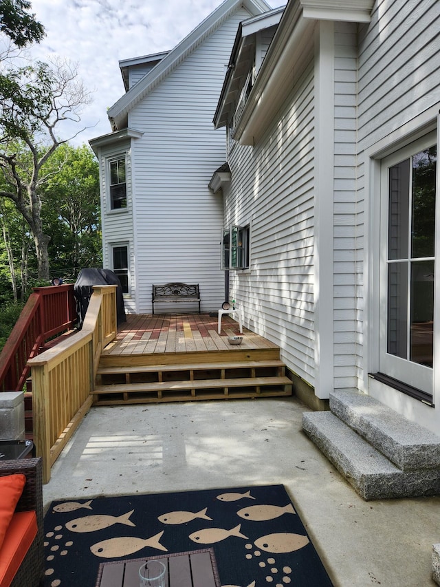 wooden terrace featuring area for grilling