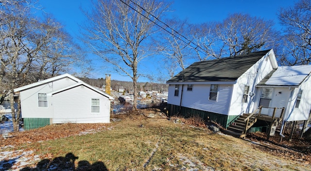 view of side of home featuring a yard