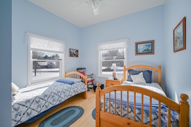 bedroom featuring light wood-type flooring and ceiling fan