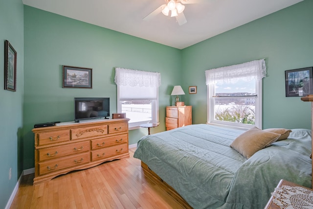 bedroom featuring light hardwood / wood-style floors and ceiling fan