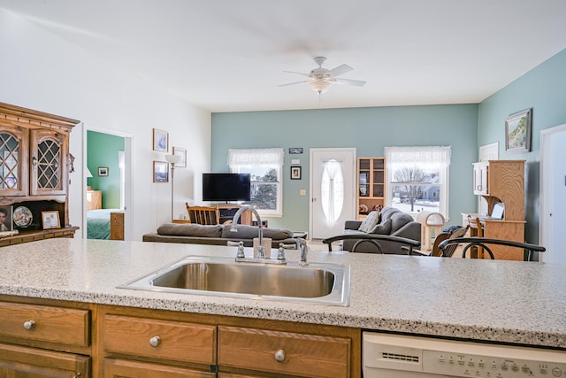 kitchen with sink, white dishwasher, and ceiling fan