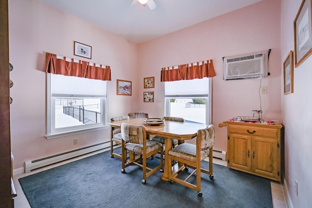 dining area with ceiling fan, a baseboard heating unit, and a wall mounted air conditioner