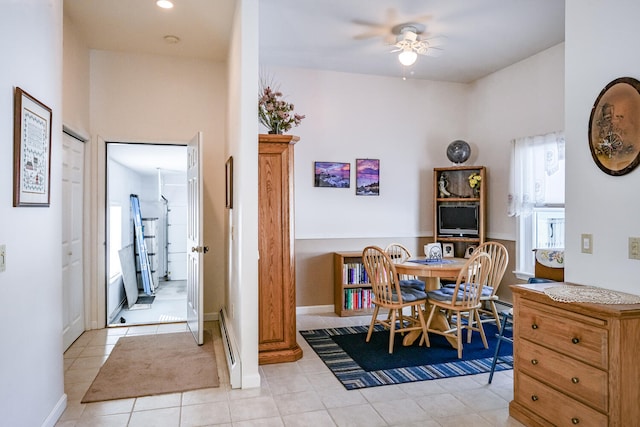 dining room with light tile patterned floors and ceiling fan