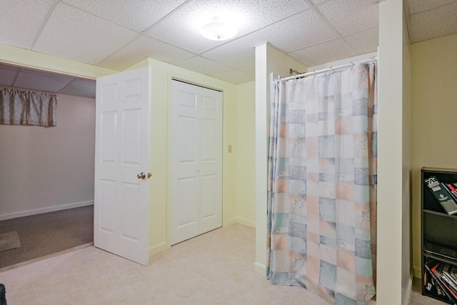 bathroom with a paneled ceiling