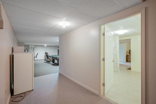 hallway featuring a drop ceiling