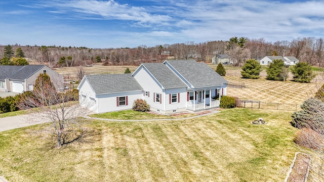 11 Sunrise Dr, Hallowell, ME 04347 - view of front facade with covered porch, fence, a shingled roof, a front yard, and driveway