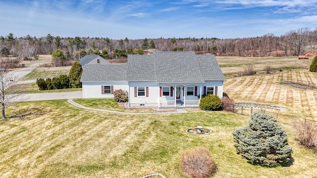 11 Sunrise Dr, Hallowell, ME 04347 - view of front of home with covered porch, fence, a shingled roof, and a front yard