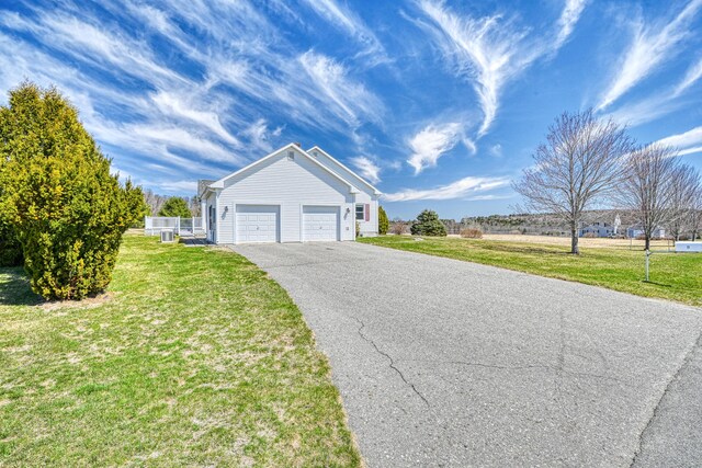 11 Sunrise Dr, Hallowell, ME 04347 - view of front facade with a front lawn, a garage, and aphalt driveway