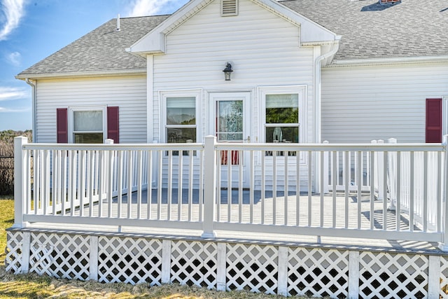 11 Sunrise Dr, Hallowell, ME 04347 - rear view of house featuring roof with shingles and a deck