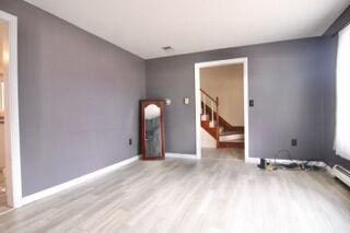 unfurnished room featuring light wood-type flooring