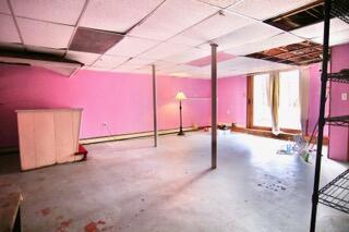 basement with a paneled ceiling