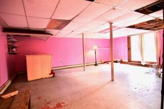 basement featuring a paneled ceiling