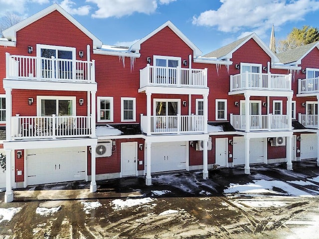 multi unit property featuring a garage