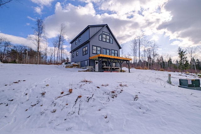 view of snow covered house