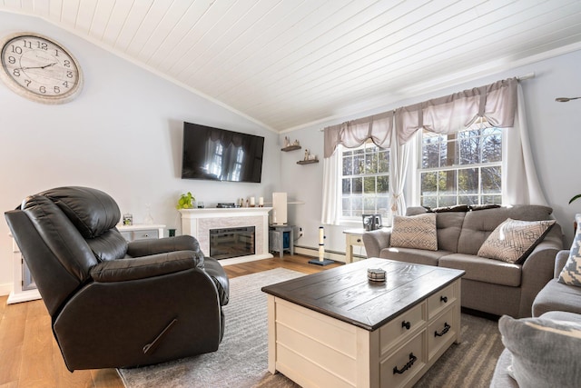 living room with lofted ceiling, wooden ceiling, baseboard heating, ornamental molding, and hardwood / wood-style flooring