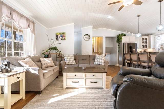 living room with crown molding, vaulted ceiling, wooden ceiling, hardwood / wood-style flooring, and ceiling fan