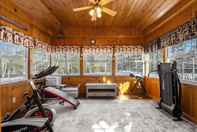 sunroom with vaulted ceiling, wooden ceiling, and ceiling fan