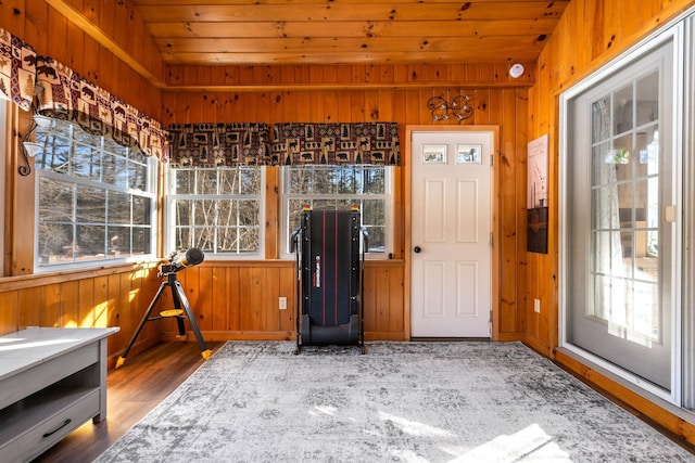 unfurnished sunroom with wooden ceiling