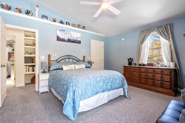 bedroom featuring ceiling fan, carpet floors, and vaulted ceiling