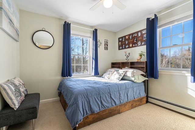 bedroom featuring a baseboard radiator, carpet, and ceiling fan