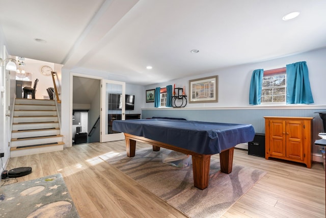 rec room with pool table and light hardwood / wood-style floors