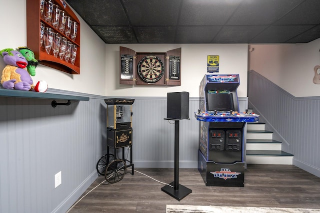 bar featuring wood-type flooring and a drop ceiling